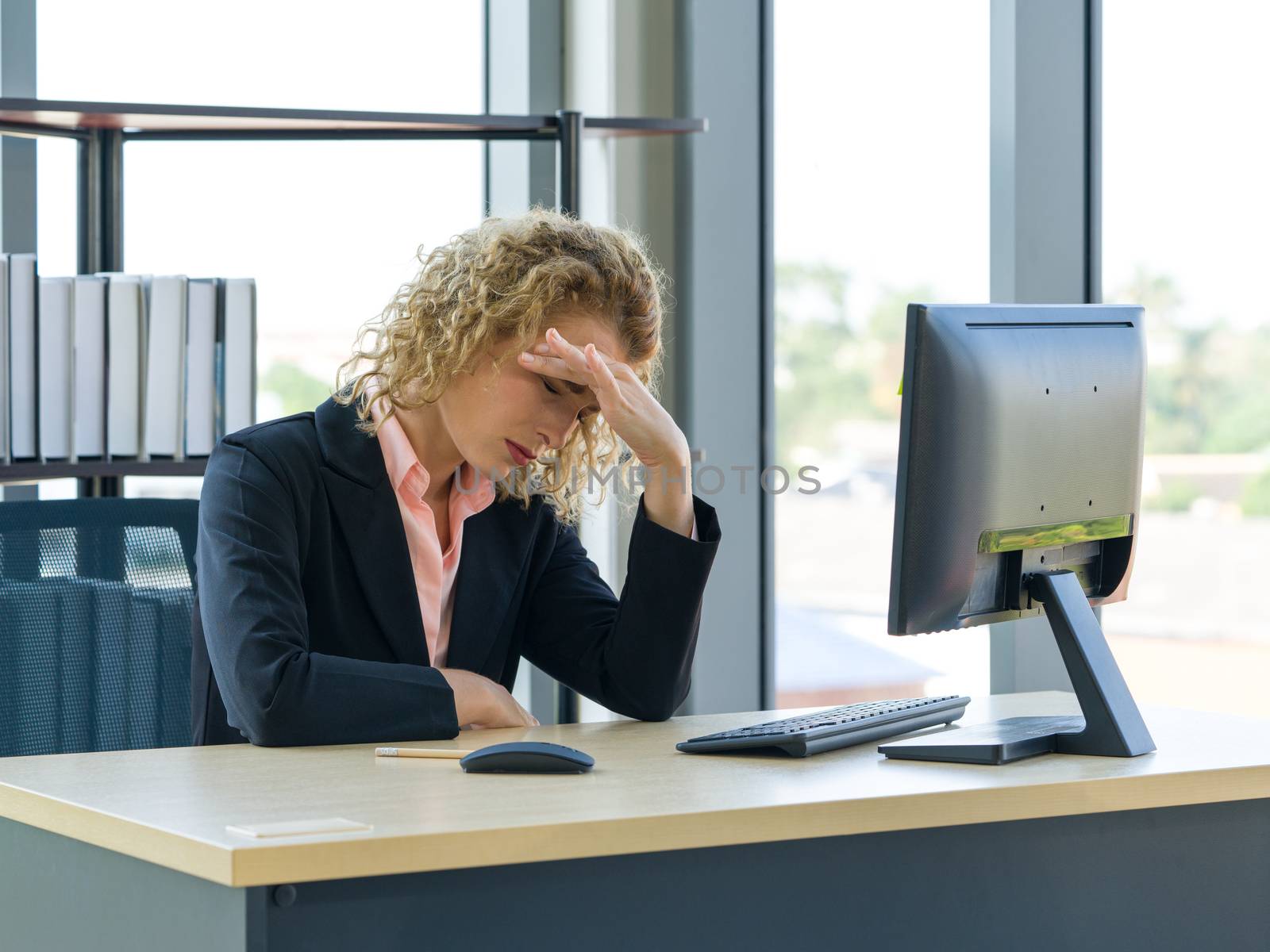 Morning work atmosphere In a modern office. Ukrainian employees rest their eyes due to dizziness and headaches. After clearing the remaining pending work.