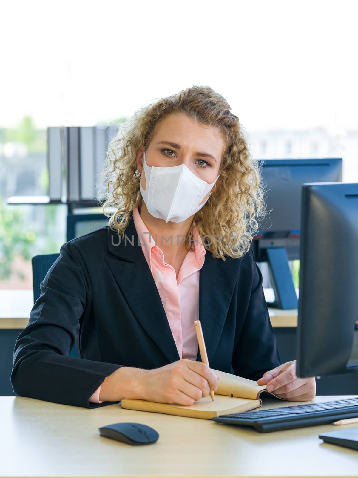 Reduce the spread of Coronavirus disease 2019 (COVID-19) in the office.  Ways to prevent the transmission of disease can be done by wearing a surgical mask. by chadchai_k
