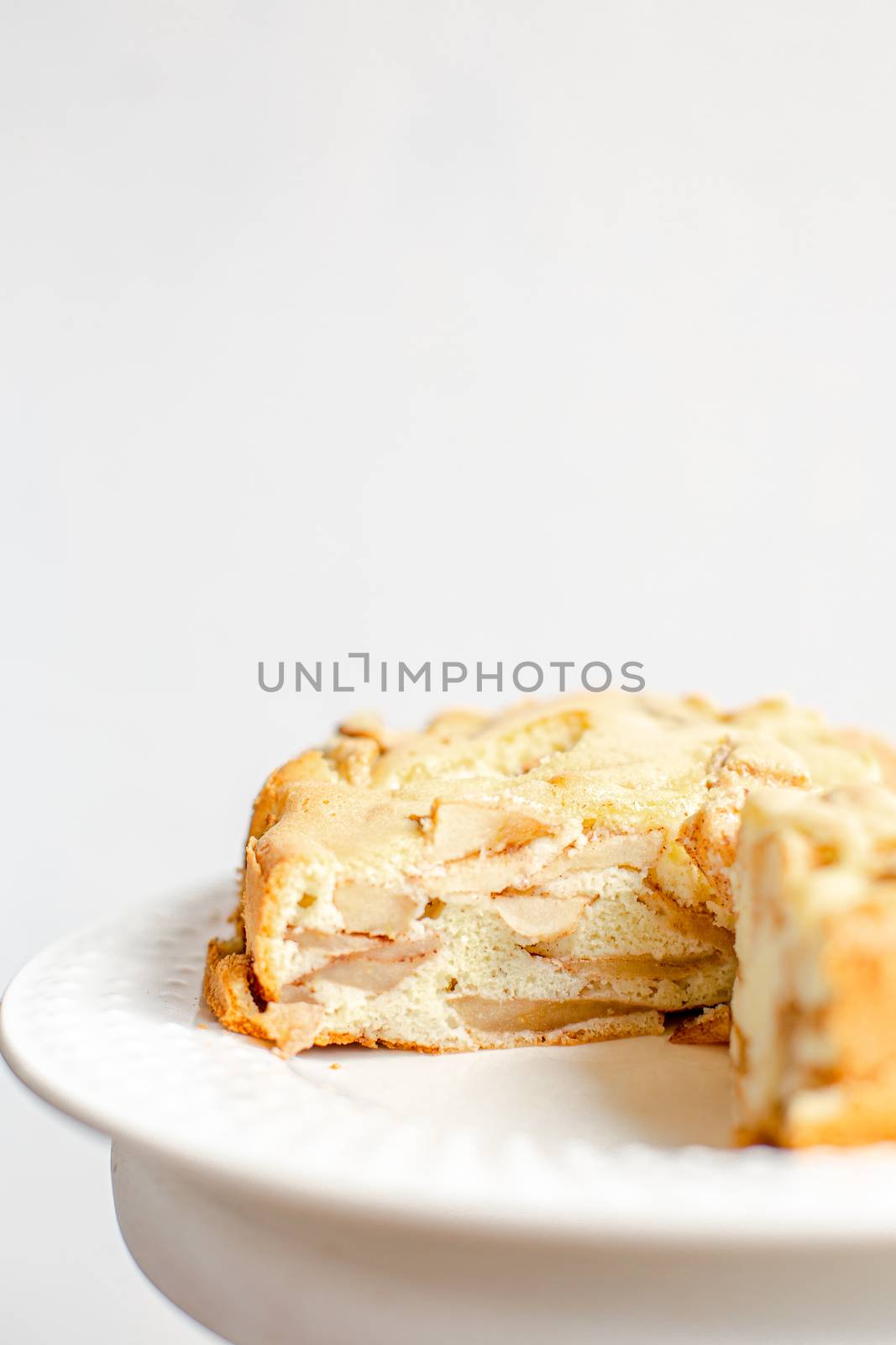 Homemade Organic Apple Pie Dessert Charlotte. Cobbler Apple Pie on White Plate and white background