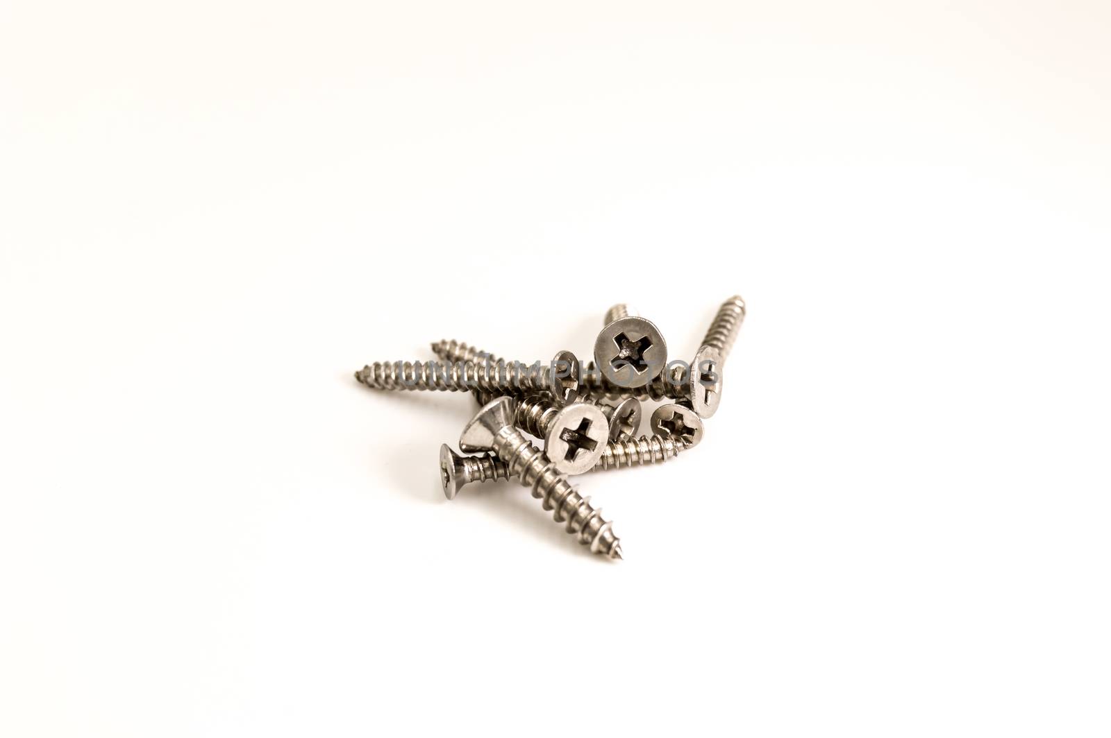 Pile of metal Phillips screws  by Philou1000