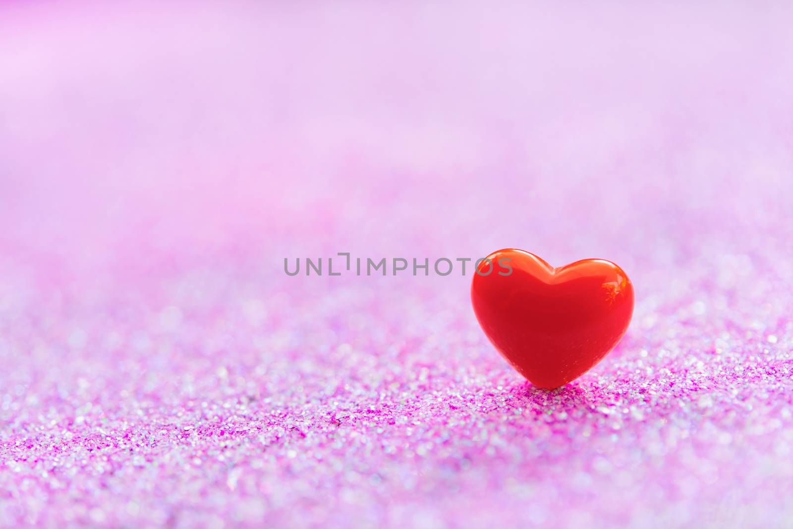 Valentines Day background with Red heart shapes on abstract light pink glitter background, Copy space