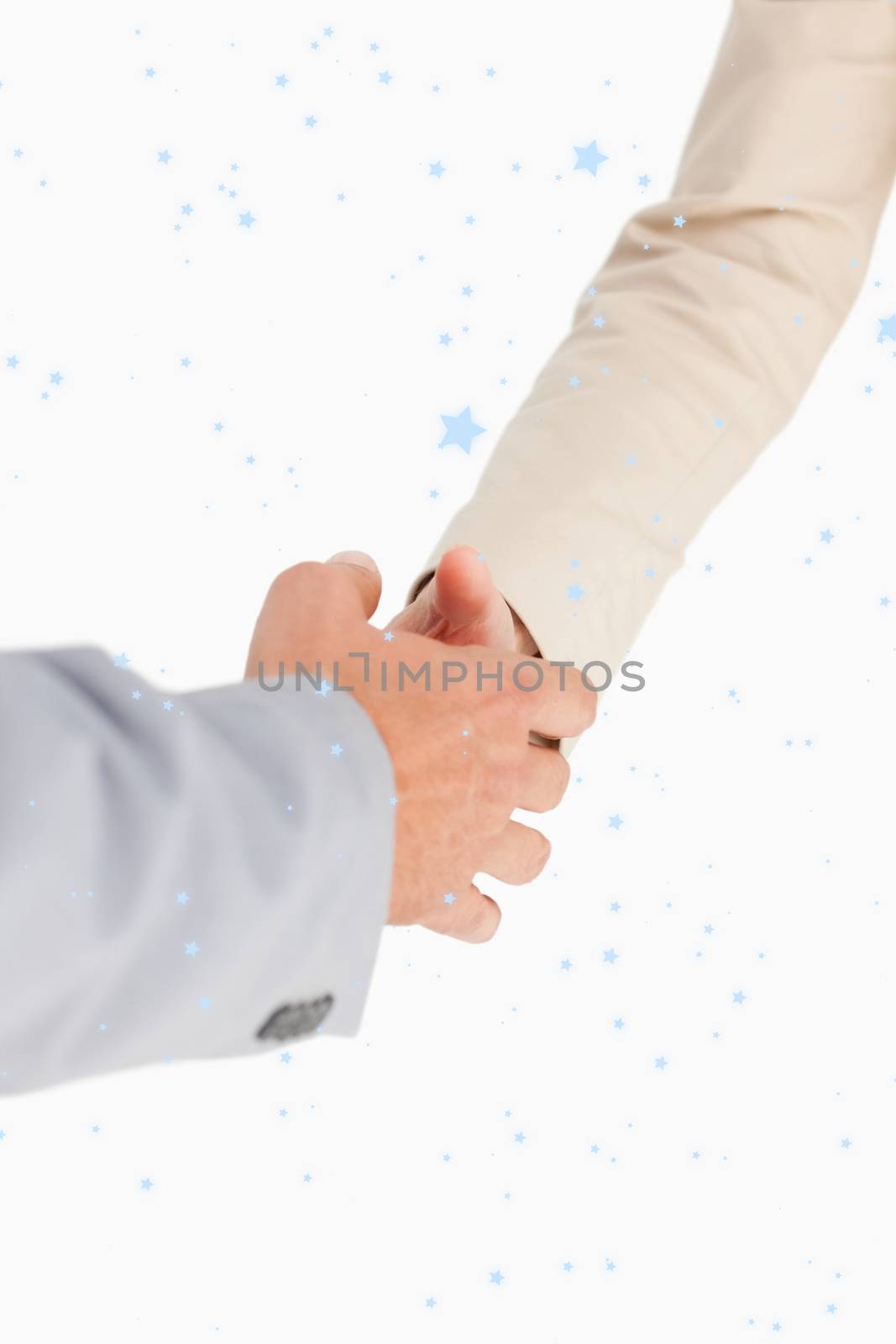 People shaking hands against snow falling