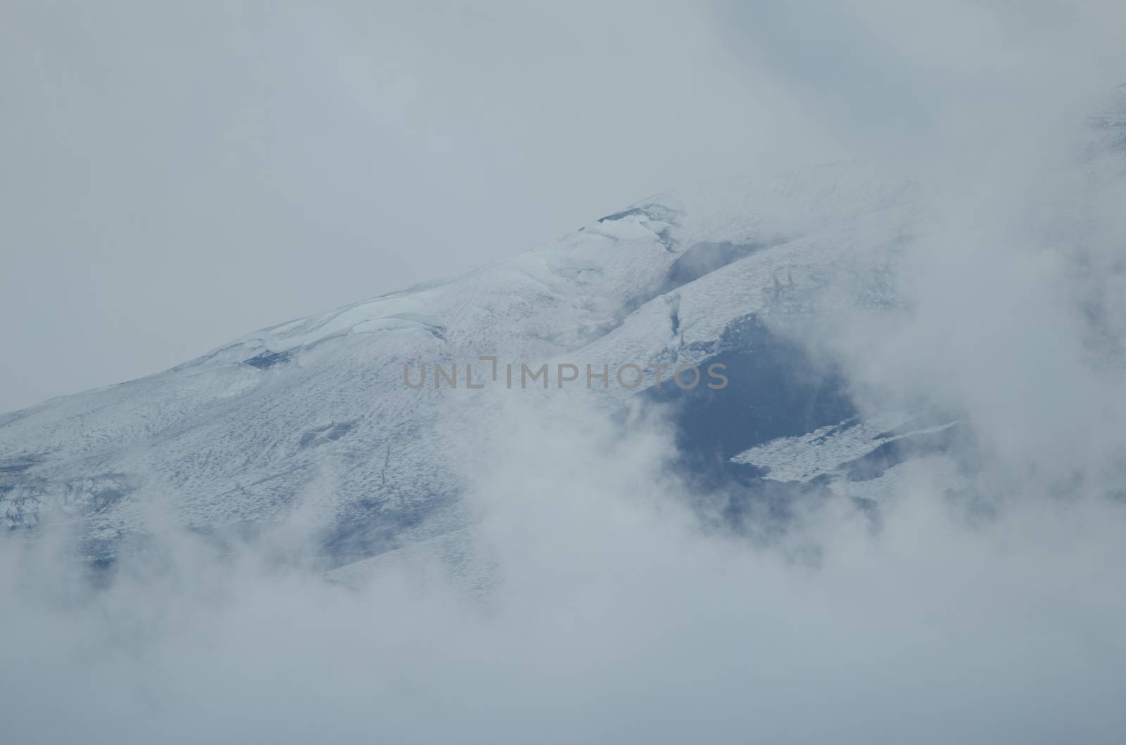 Slope of the Llaima volcano covered by clouds. by VictorSuarez