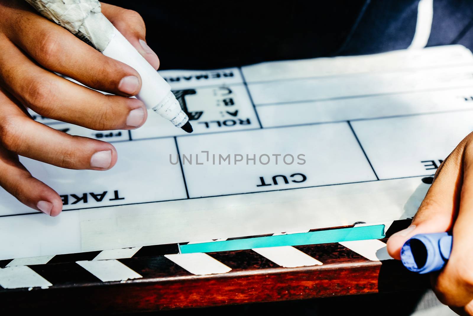 Film Slate, close up image of film production crew holding Film Slate on set