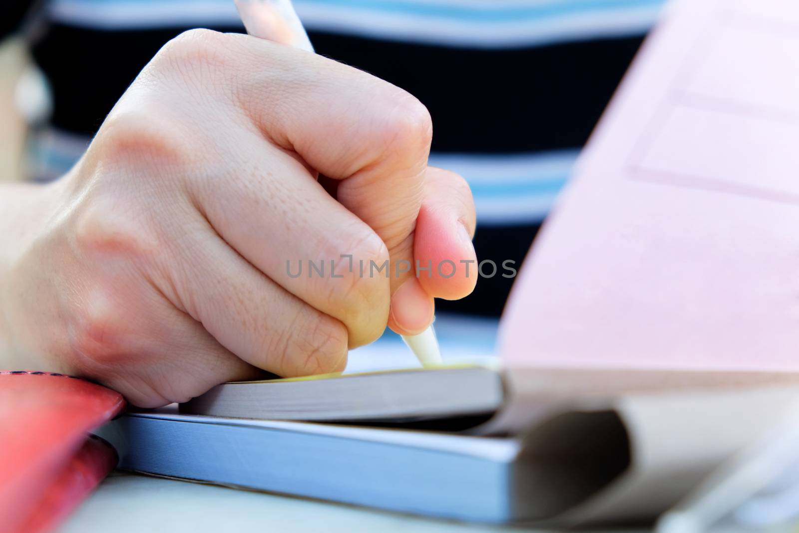 Close up female hands of accountant with calculator and pen. business accounting background.