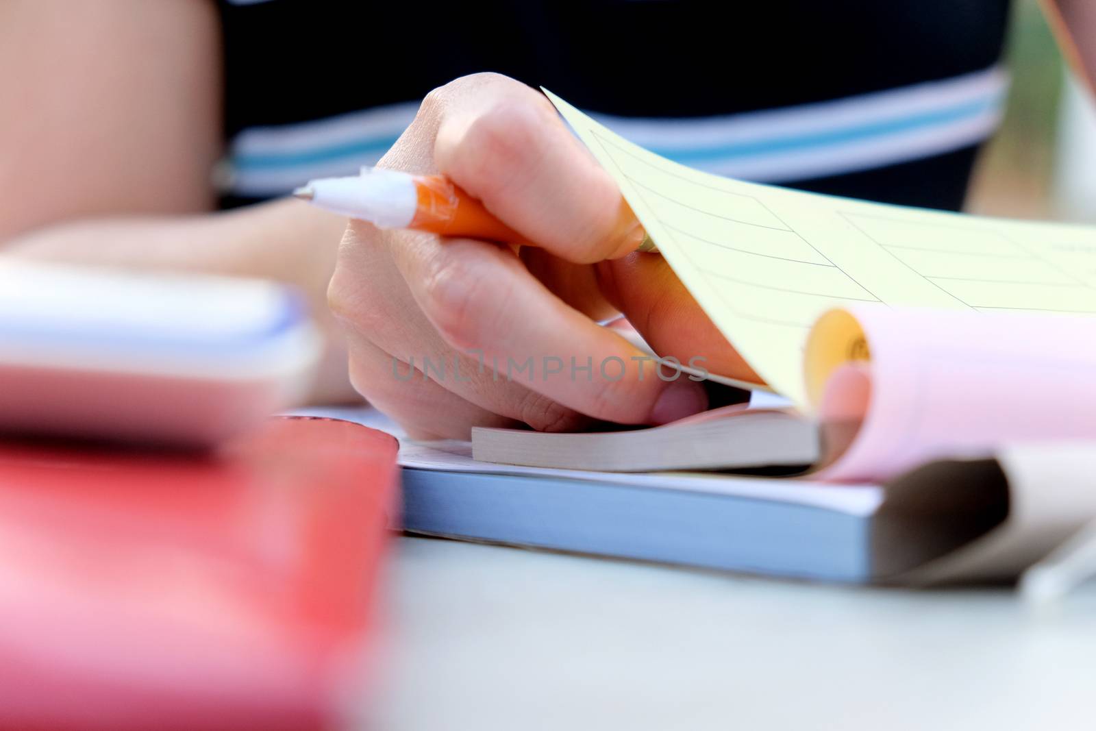 Close up female hands of accountant with calculator and pen. business accounting background.
