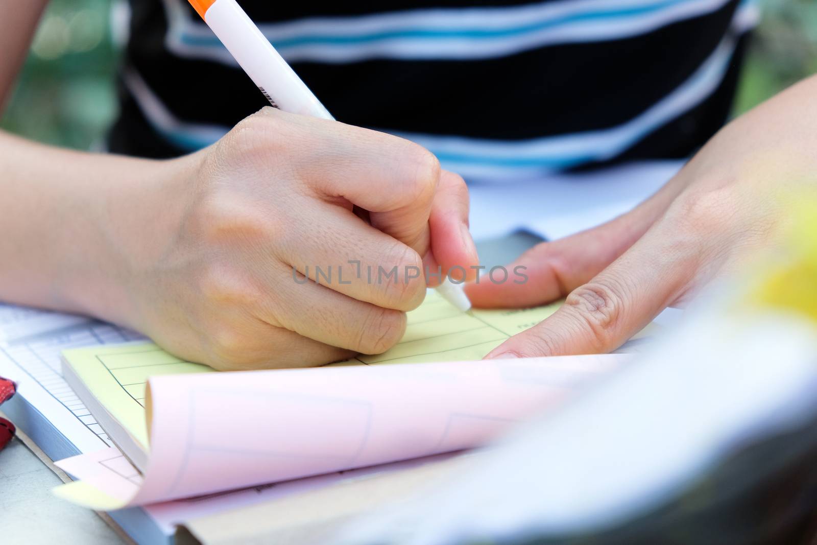 Close up female hands of accountant with calculator and pen. business accounting background.