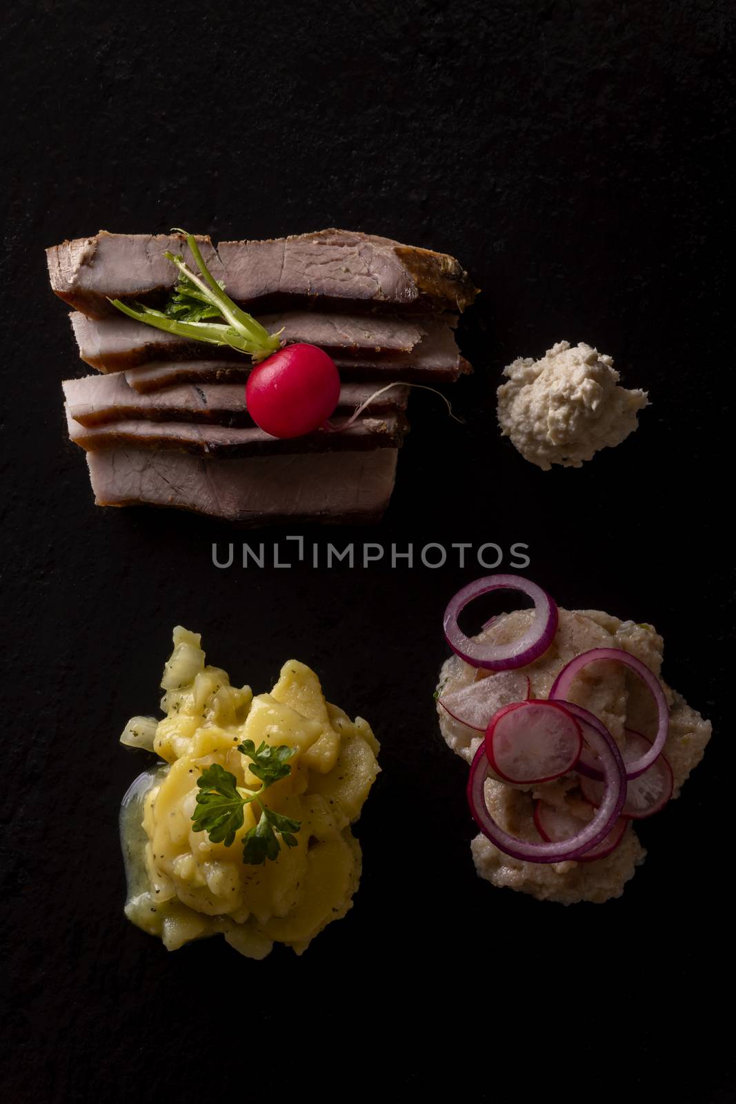 slices of cold roast pork with onions