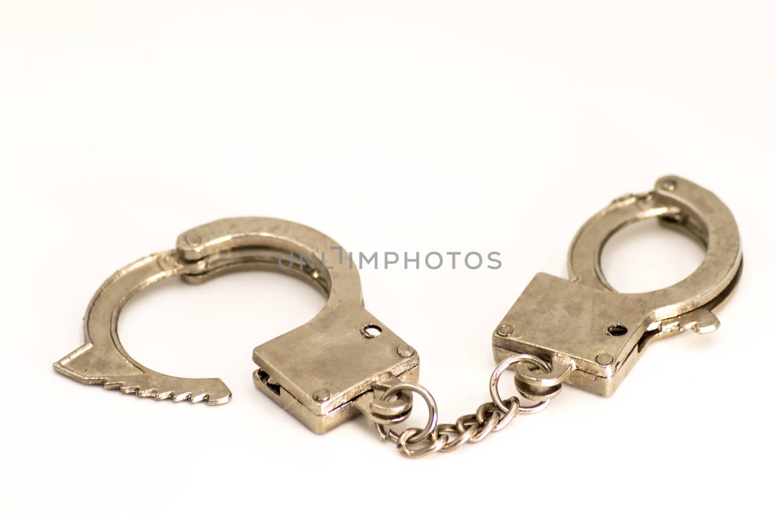 Pair of handcuffs close up front view by Philou1000