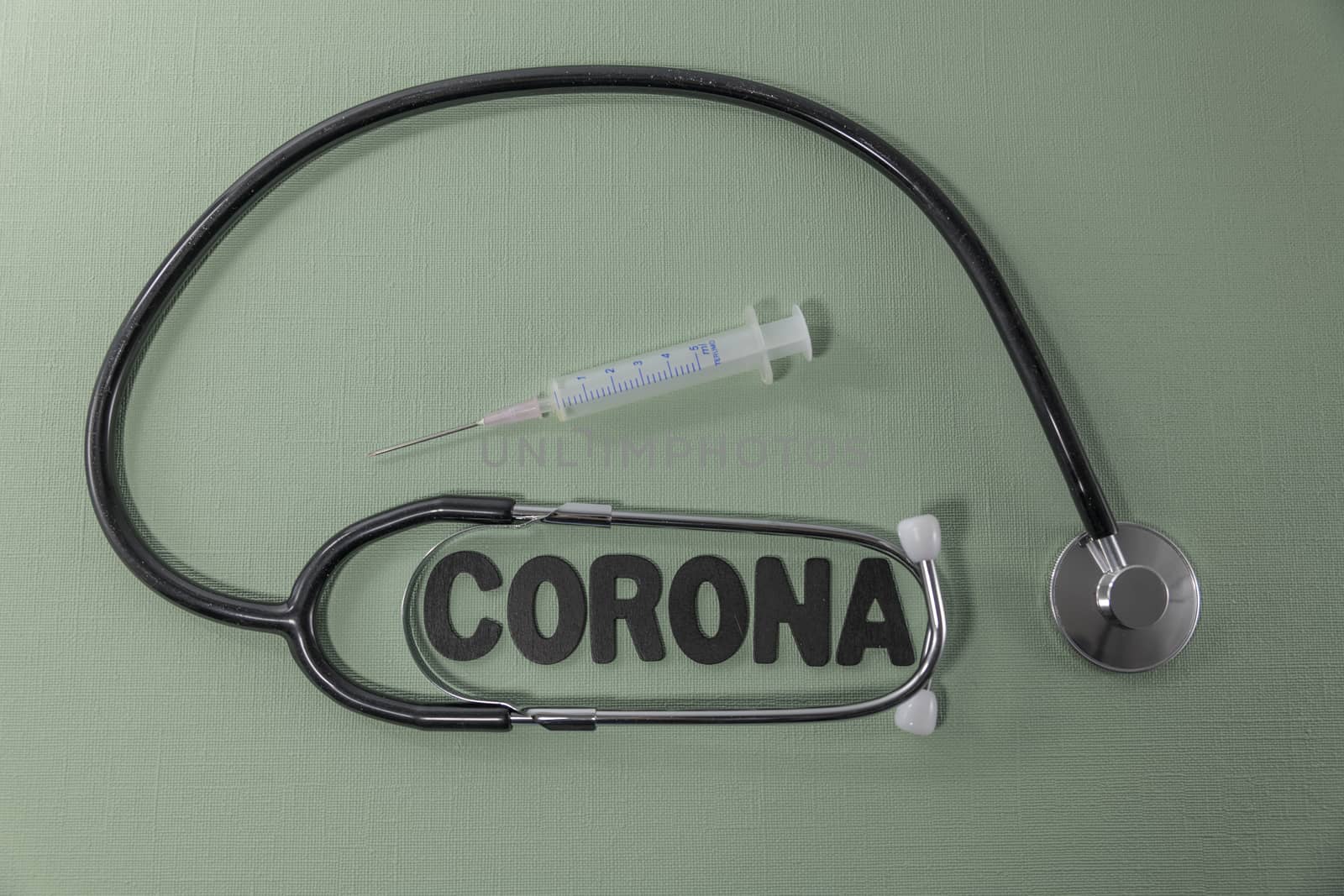 Covid 19 virus conceptual image with text in black and green and stethoscope