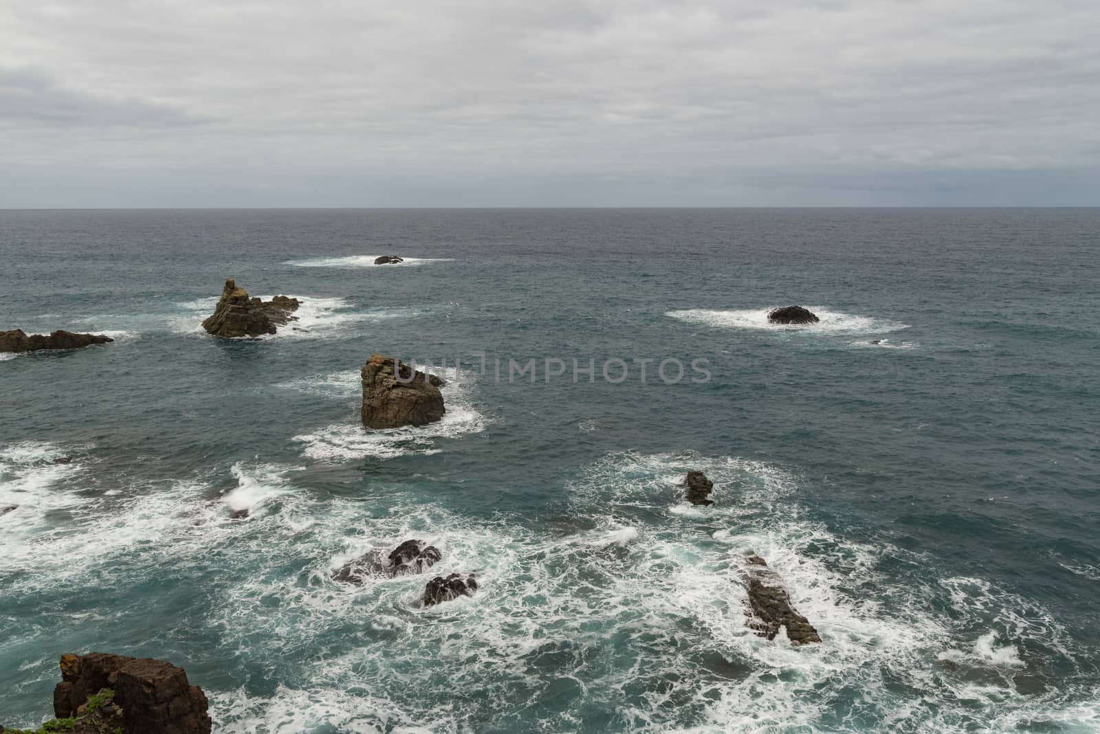 View to waves and Los Galiones cliff near Roque de Las Bodegas beach in the area of Taganana, Tenerife Island,  Spain