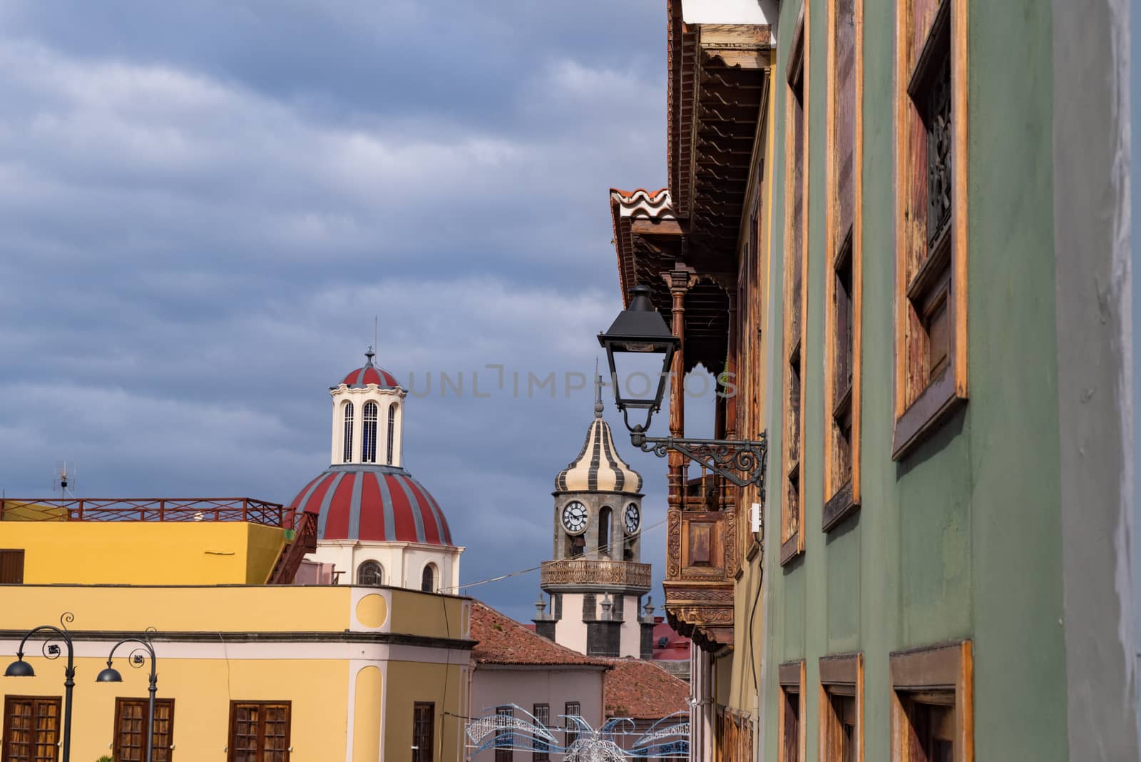 Street with typical colonial style houses on medieval street of old town la Orotava with Church of Nuestra Senora de la Concepcion (Church of Our Lady of Conception)