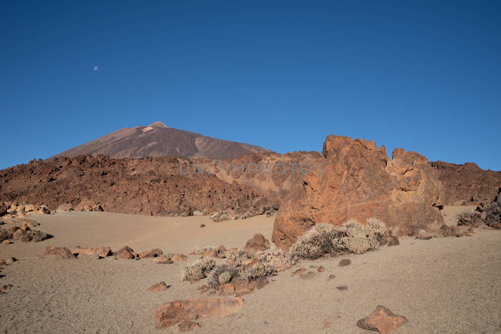 Martian landscape on the eastern slopes of Montana Blanca Mirador las Minas de San Jose with Teide mount at background. Teide National park, Tenerife, Canary islands, Spain