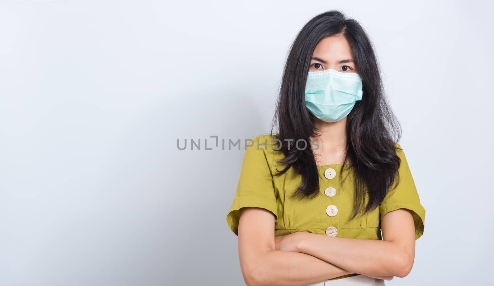 woman wearing face mask protects filter dust pm2.5 by Sorapop