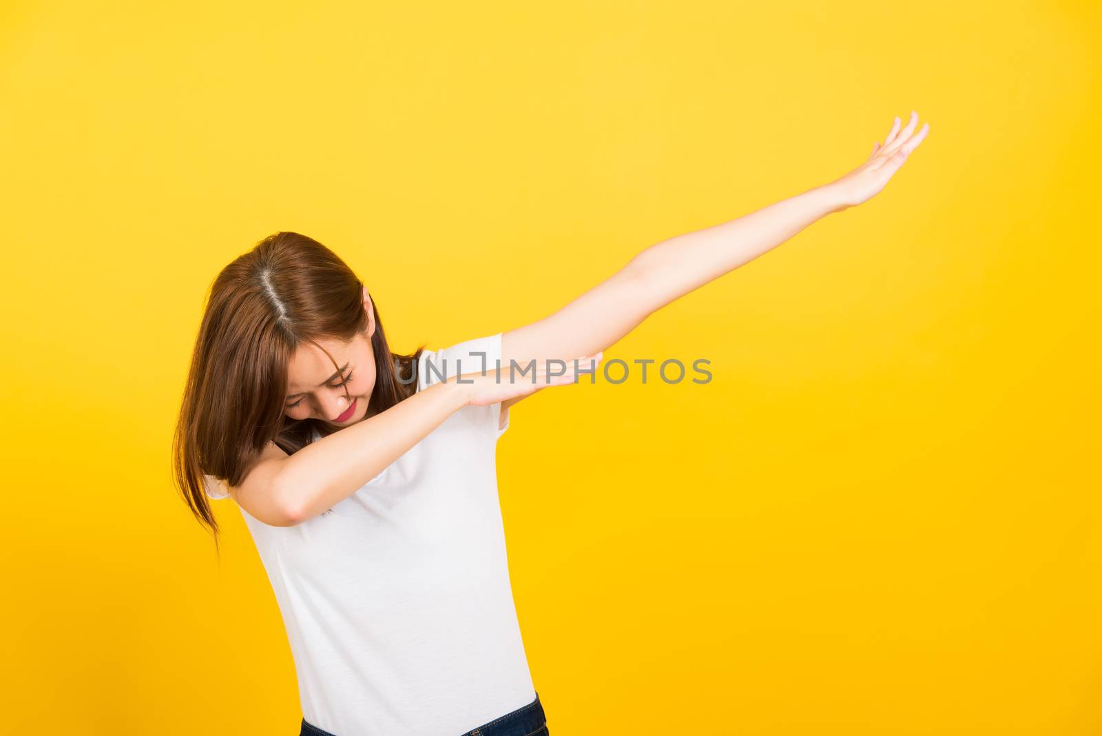 woman teen smile standing wear t-shirt move showing DAB dance ag by Sorapop