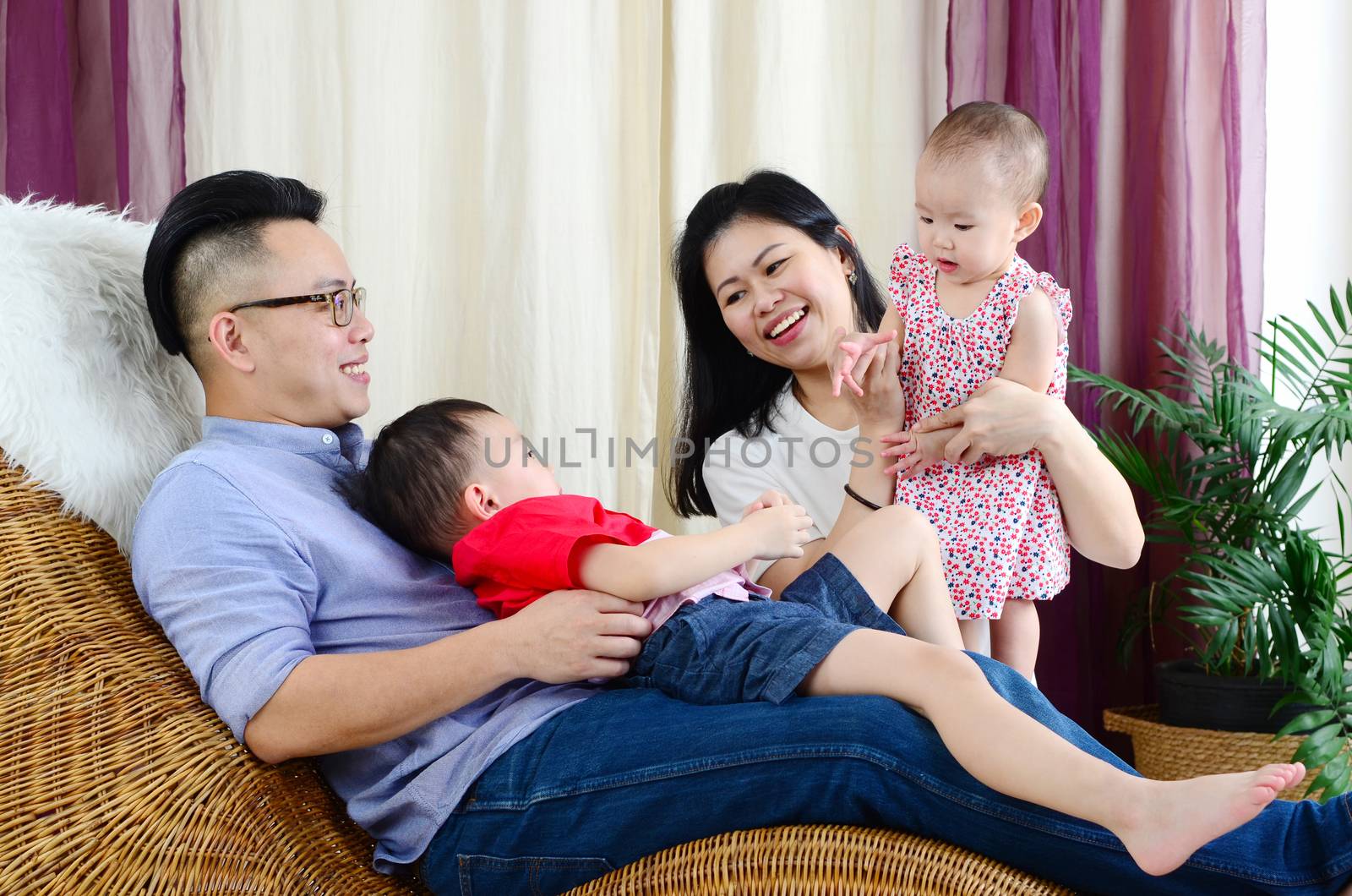 Asian family playing  at living room