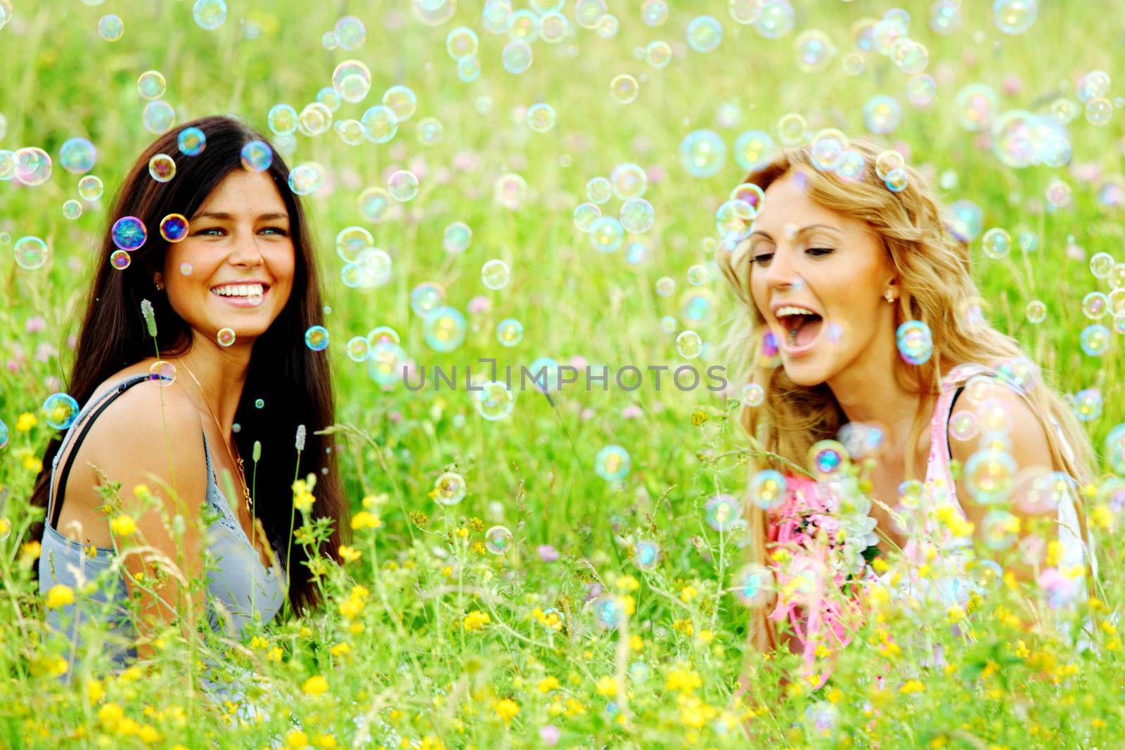 Girlfriends on summer grass by Yellowj