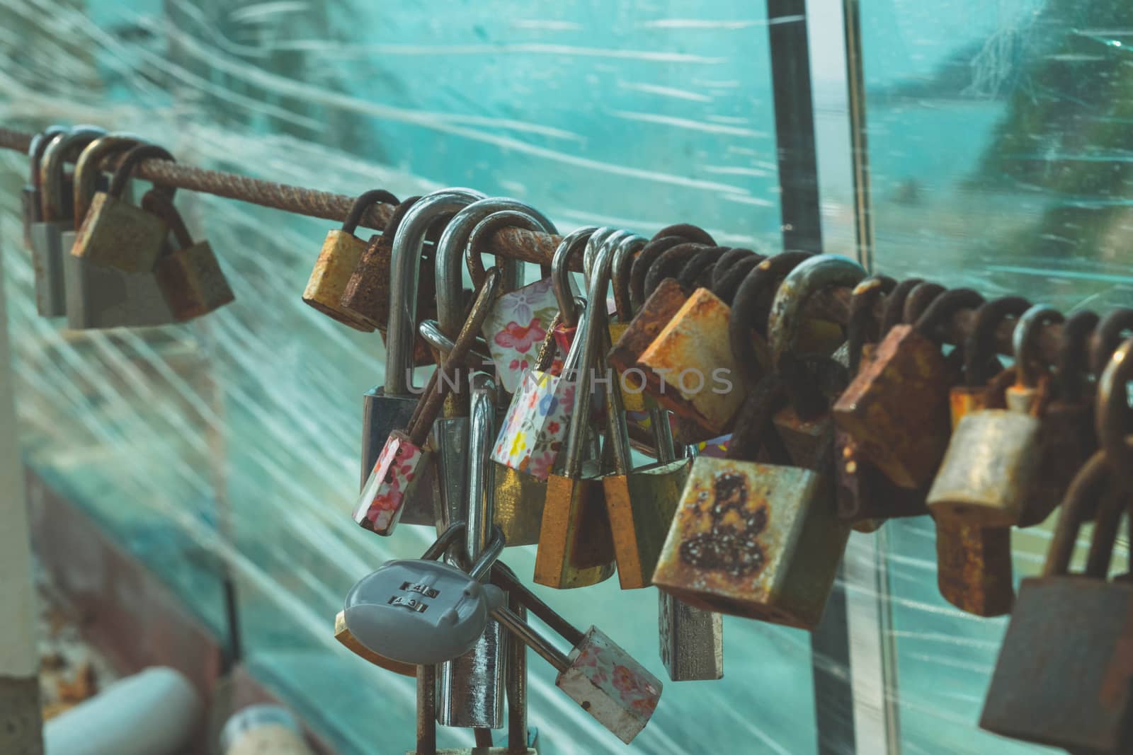 The key lock by lover couple at Noen Nangphaya View Point , Chanthaburi, Thailand, belief that prayer is complete, Concept Faith in a stable love