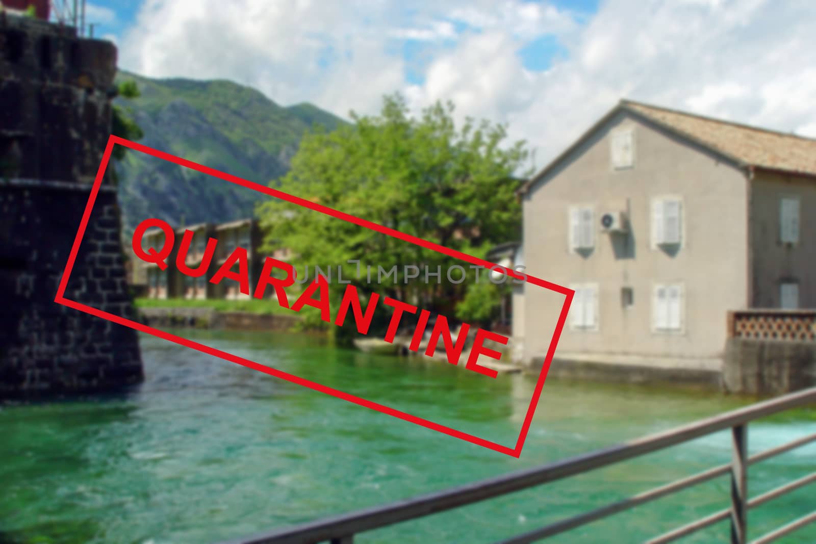 Text Quarantine against the background of medieval architecture in Montenegro . The concept of a high probability of a new coronavirus outbreak in traveling tourists