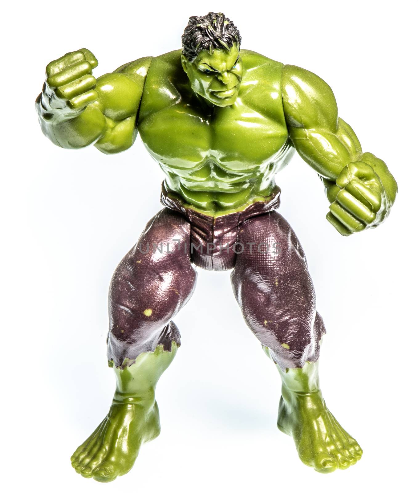 Action figure of a muscular angry green man, small toy