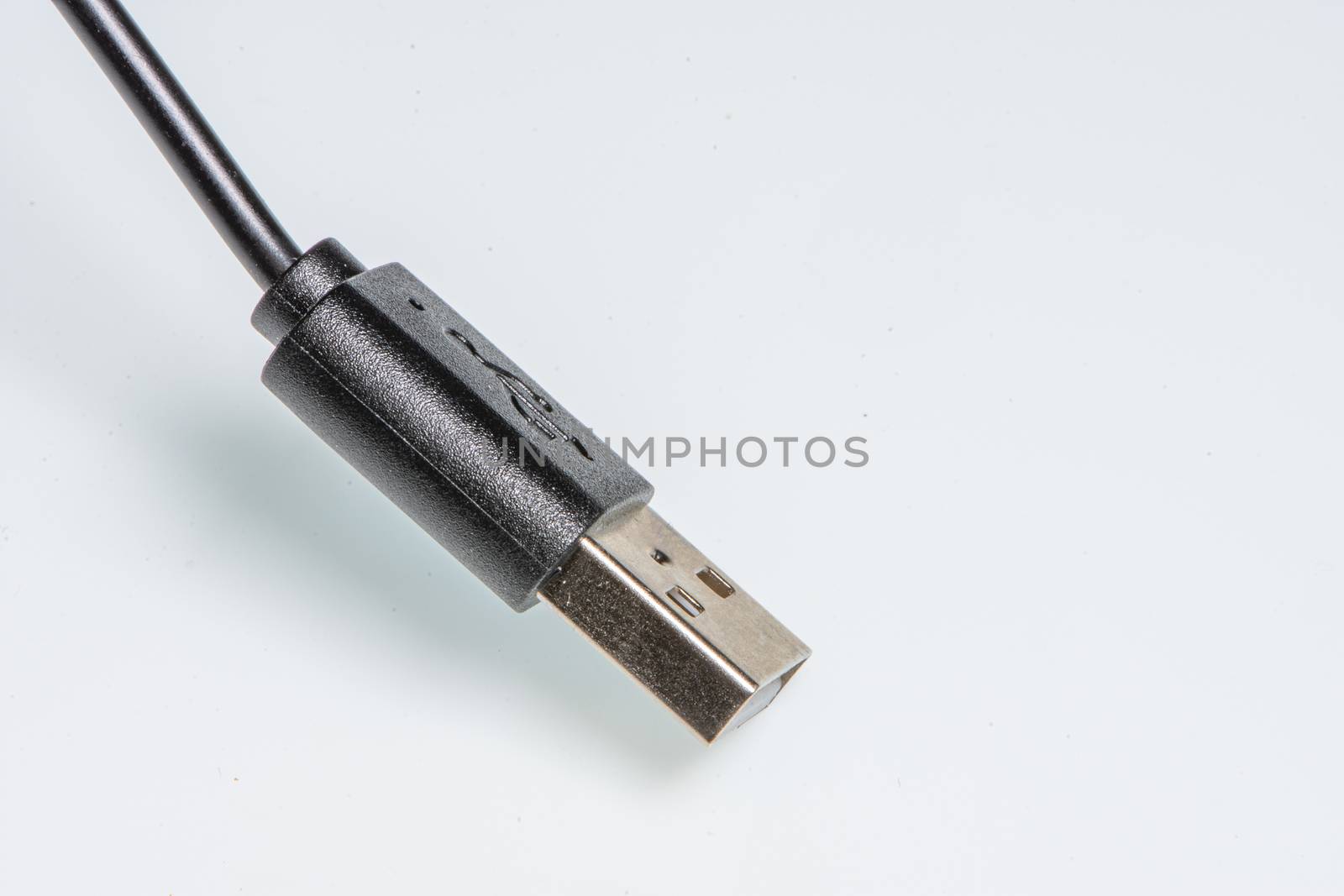 detail of a standard black usb connector by brambillasimone