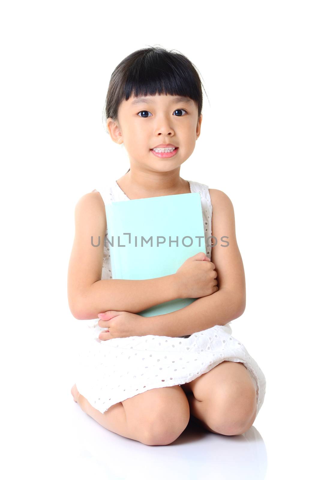 Asian girl sitting on the floor and reading