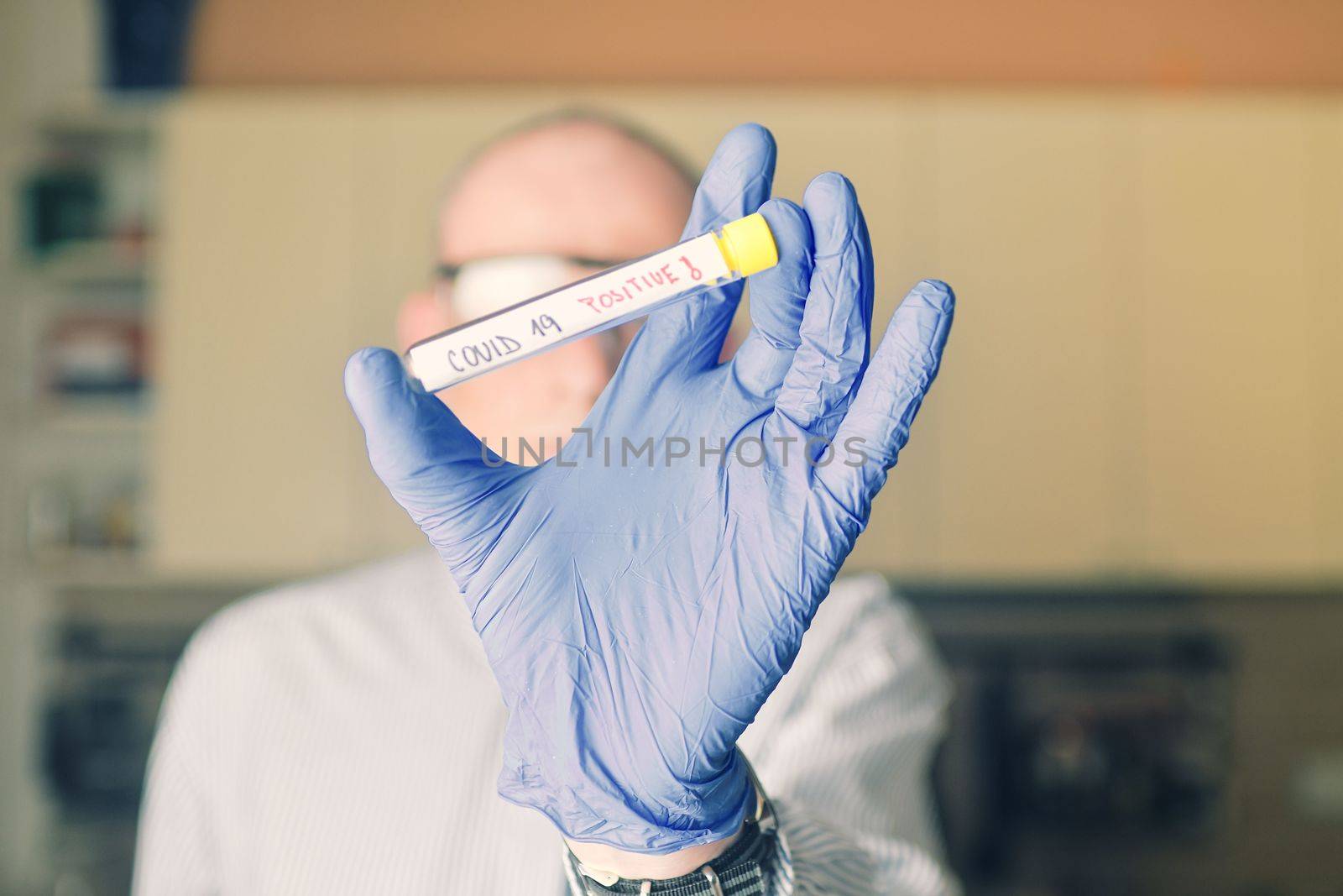 Doctor holds COVID 19 Coronavirus vaccine in his hand, infected sample in the sample tube, Vaccine and syringe injection It use for prevention, immunization and treatment from COVID-19