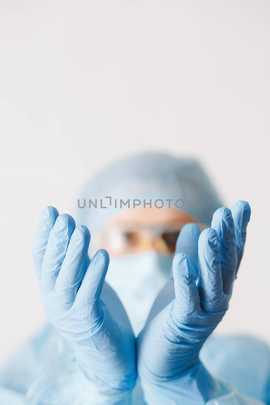 Close up of doctor hand holding. Mock up. Medical equipment. A doctor wearing personal protective equipment including mask, goggle, and suit to protect COVID 19 coronavirus infection.