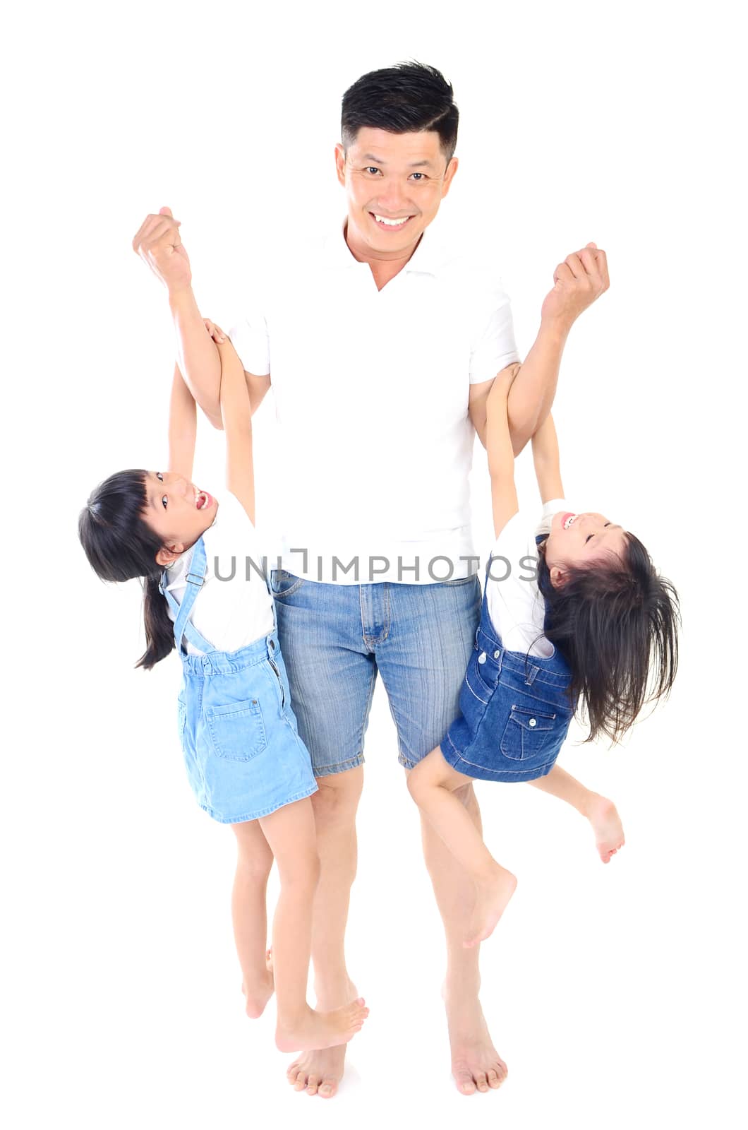 Asian father and her daughters indoor portrait