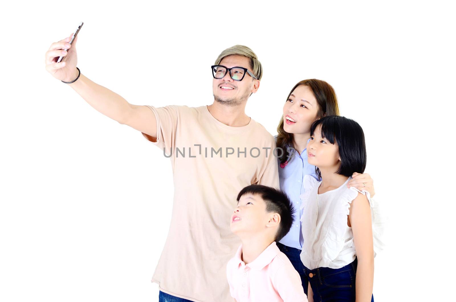 Happy family taking picture together in studio, isolated over white background