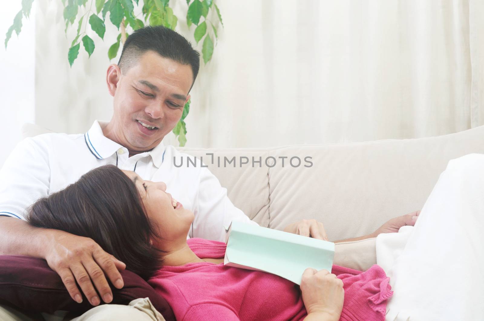 Asian Middle age couple looking at each other with love