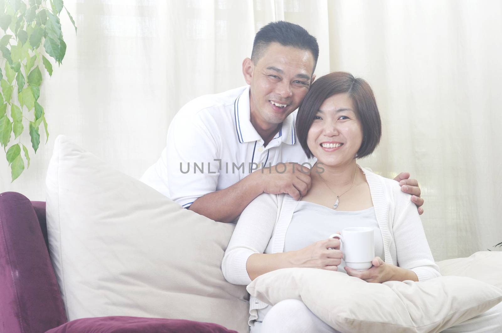 Happy Asian Middle age couple  in love having a good time at home