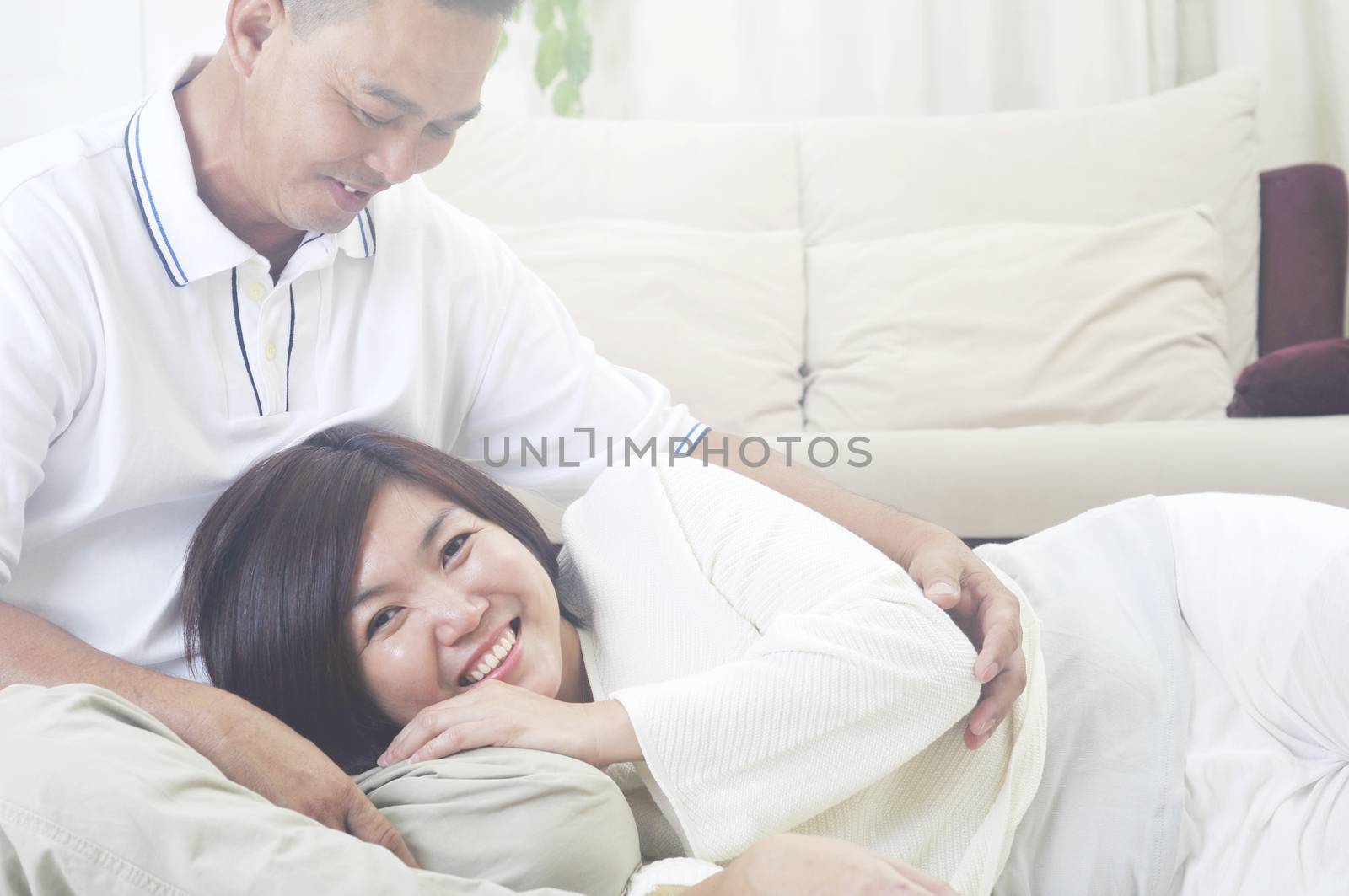 Happy Asian Middle age couple  in love having a good time at home