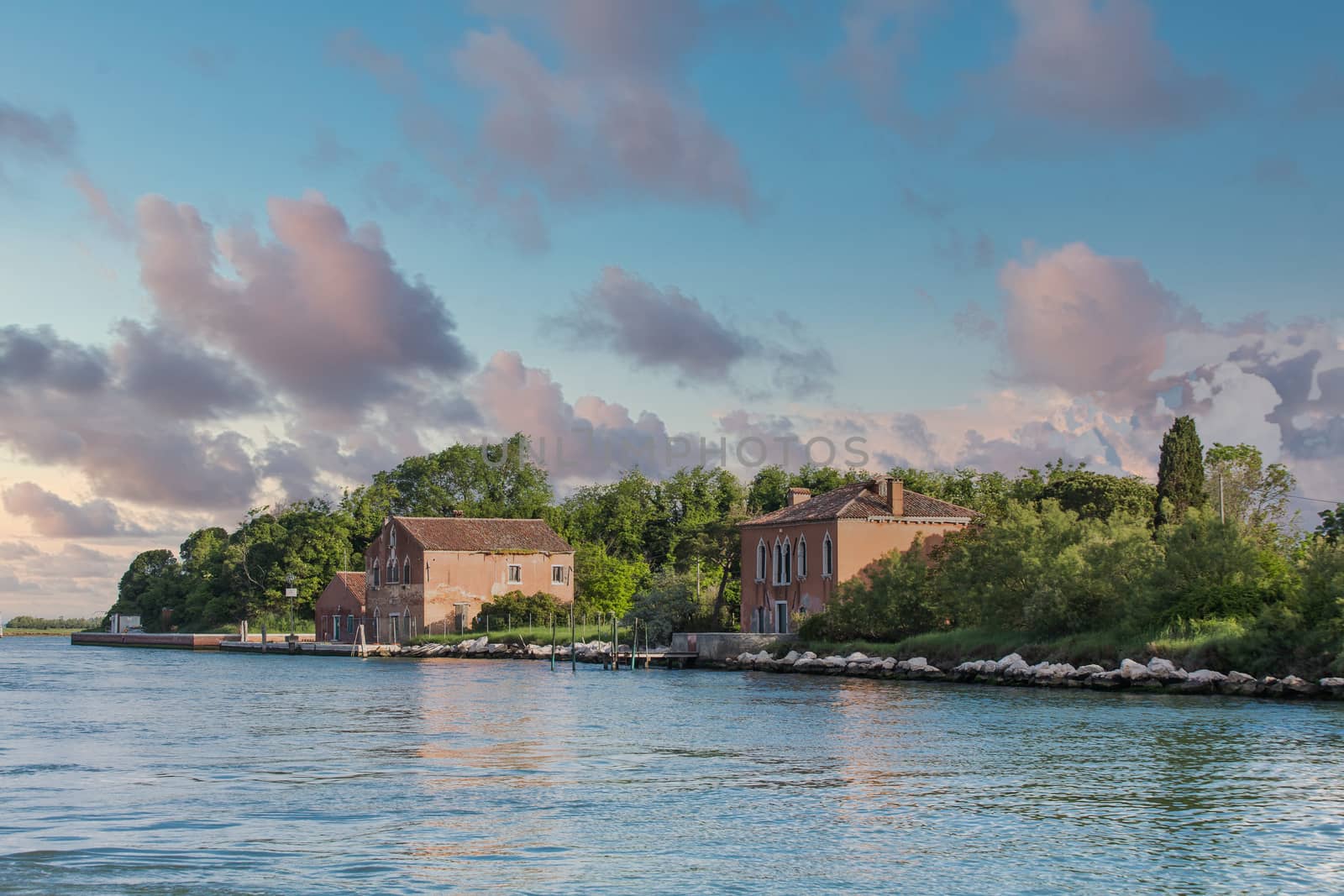 Old buildings on the edge of a large canal near Venice, Italy