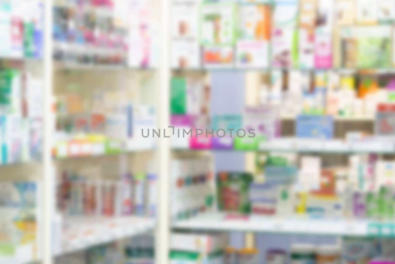 Pharmacy drugstore counter with medicine and vitamin supplement on shelves blur abstract background for montage healthcare product display