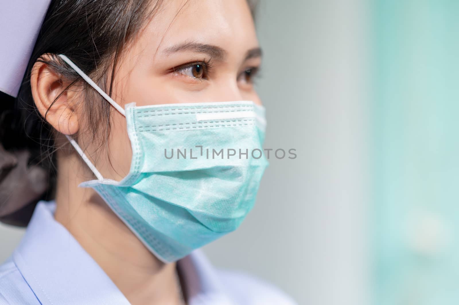 Nurses wear masks to protect against coronavirus covid19 by sarayut_thaneerat