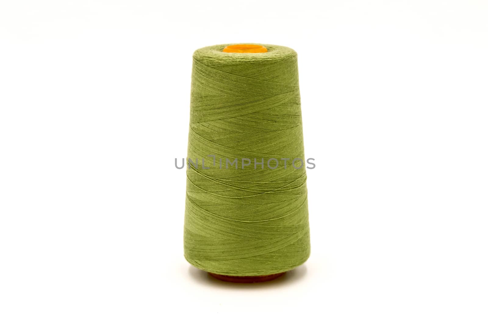 Close up of spool of colored thread  by Philou1000