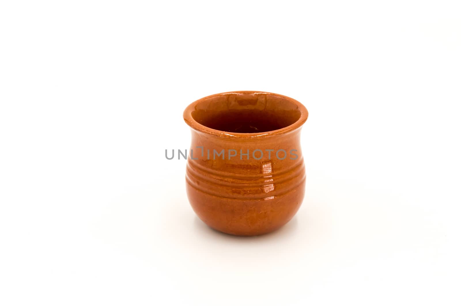 Porcelain puffed ramekin dish in brown color isolated on white background