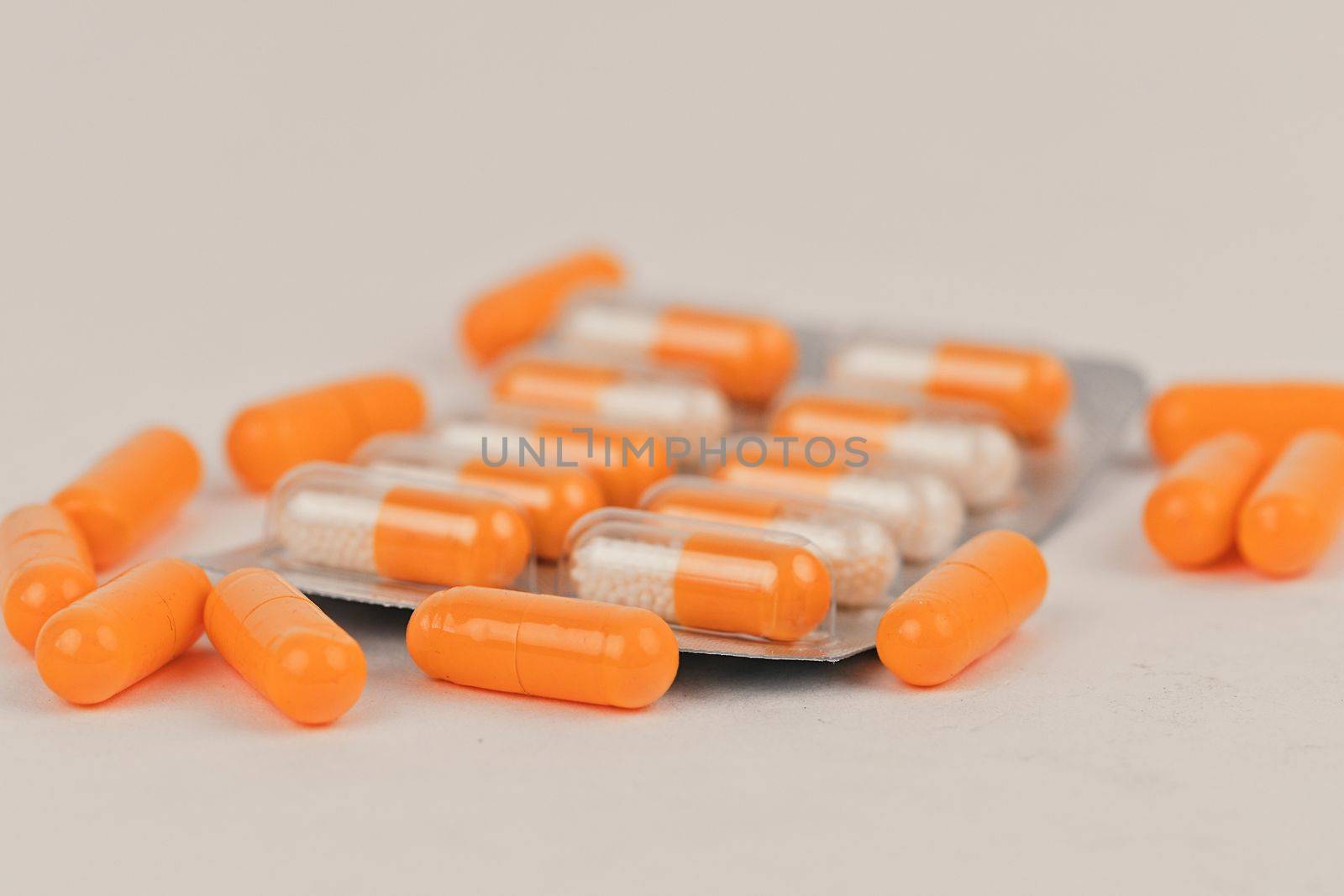 Assorted pharmaceutical medicine pills and capsules. Pills background. Heap of assorted various medicine tablets and pills different colors on white background. Health care. Copy space