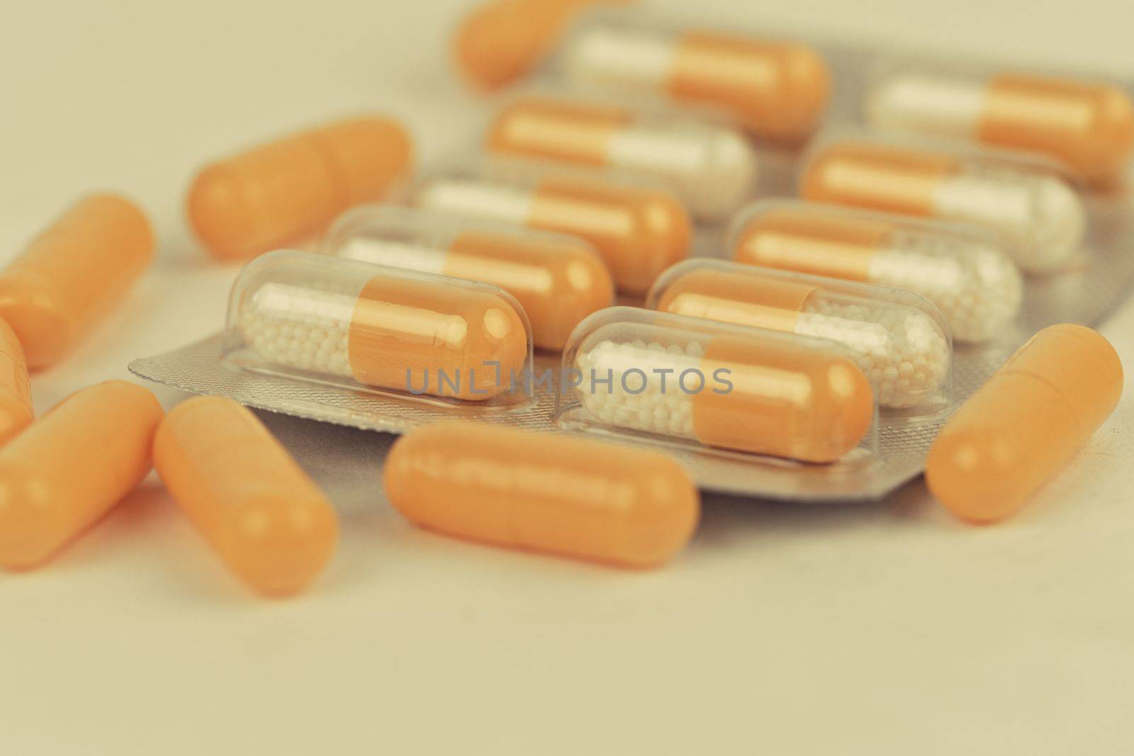 Assorted pharmaceutical medicine pills and capsules. Pills background. Heap of assorted various medicine tablets and pills different colors on white background. Health care. Copy space