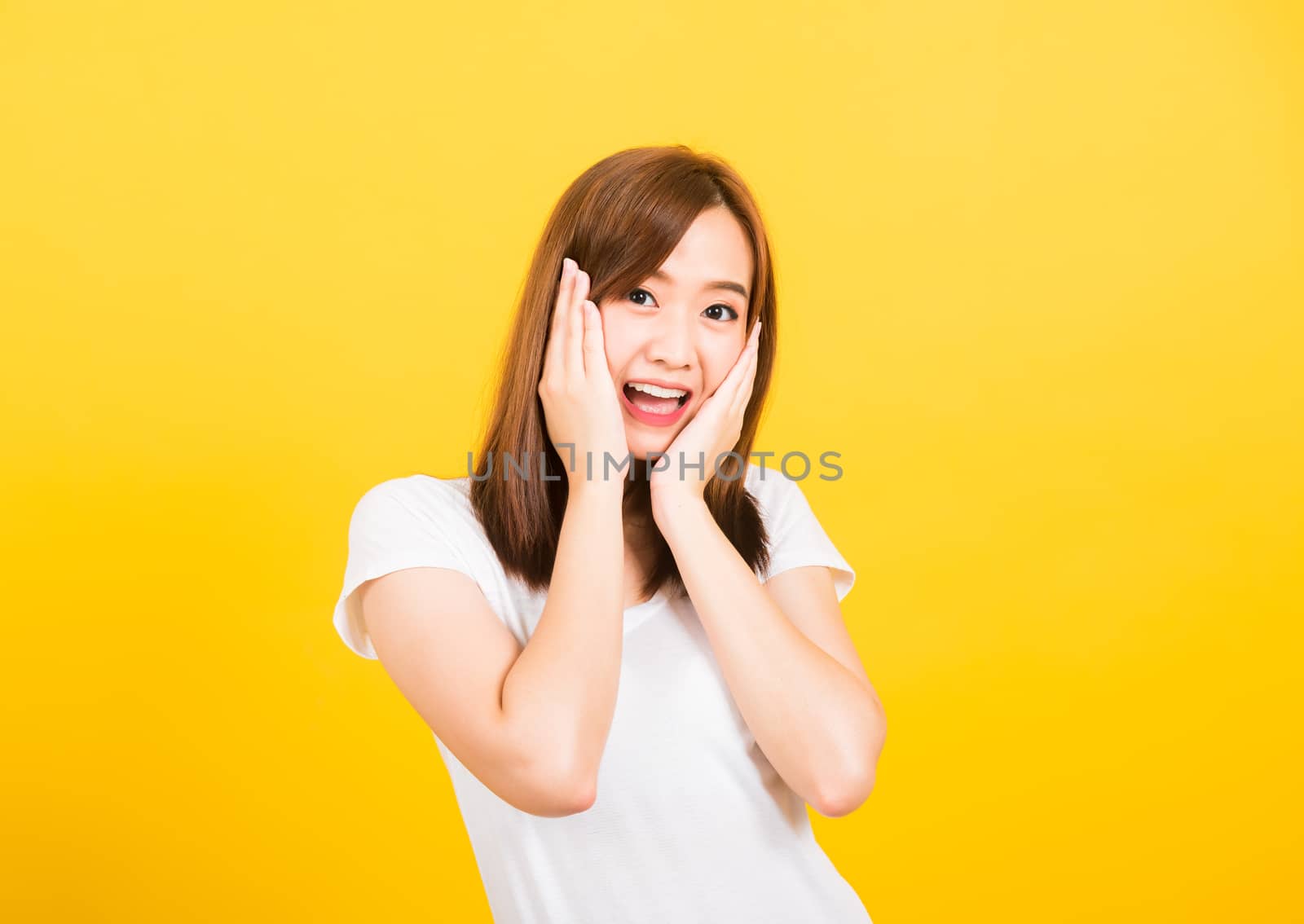 woman teen stand surprised excited celebrating open mouth gestur by Sorapop