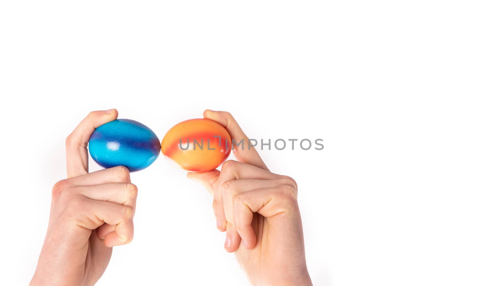 colored eggs with hands tapping and crushing eggs by PeterHofstetter