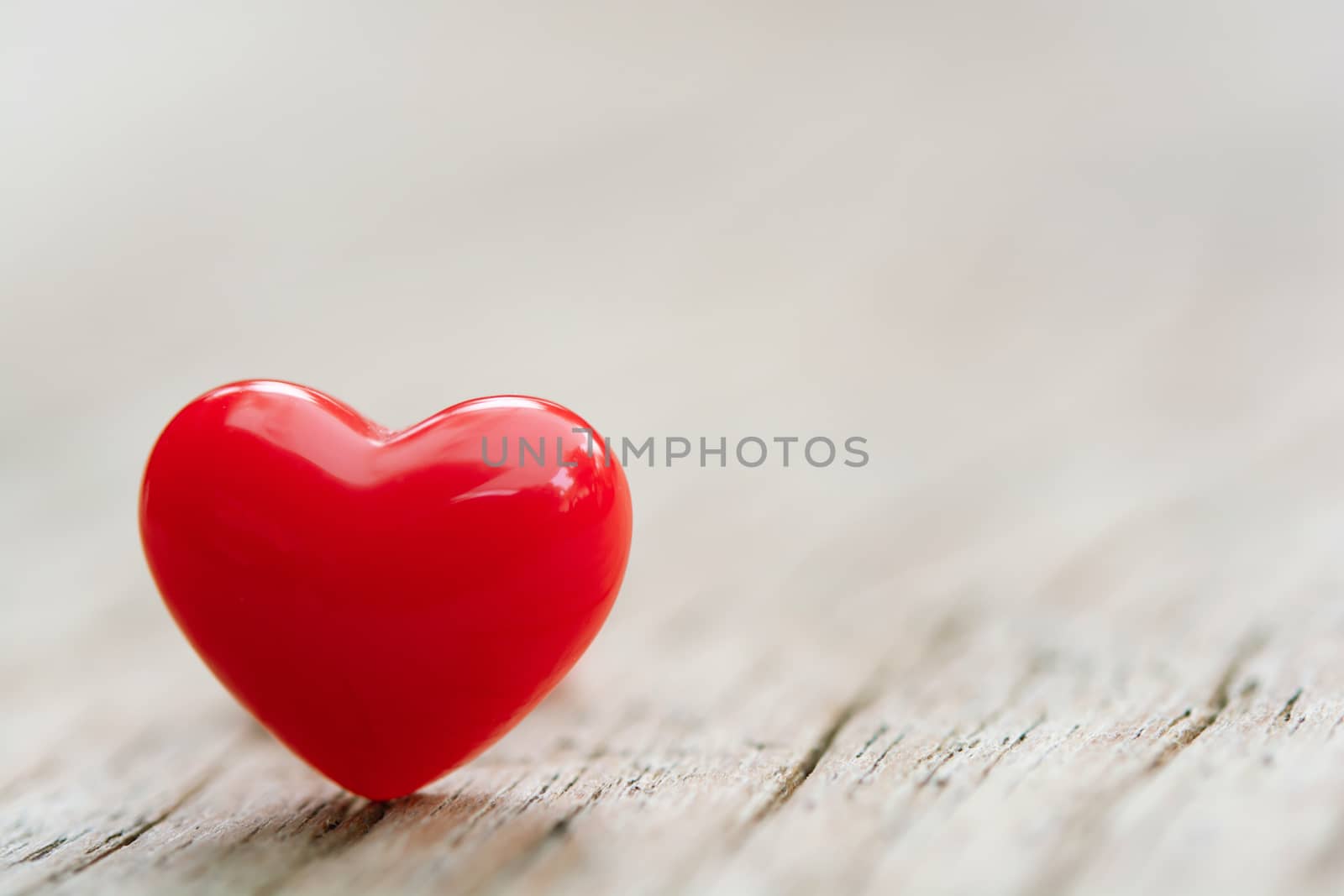 Valentines Day concept -  Red hearts on plank wooden background with copy space
