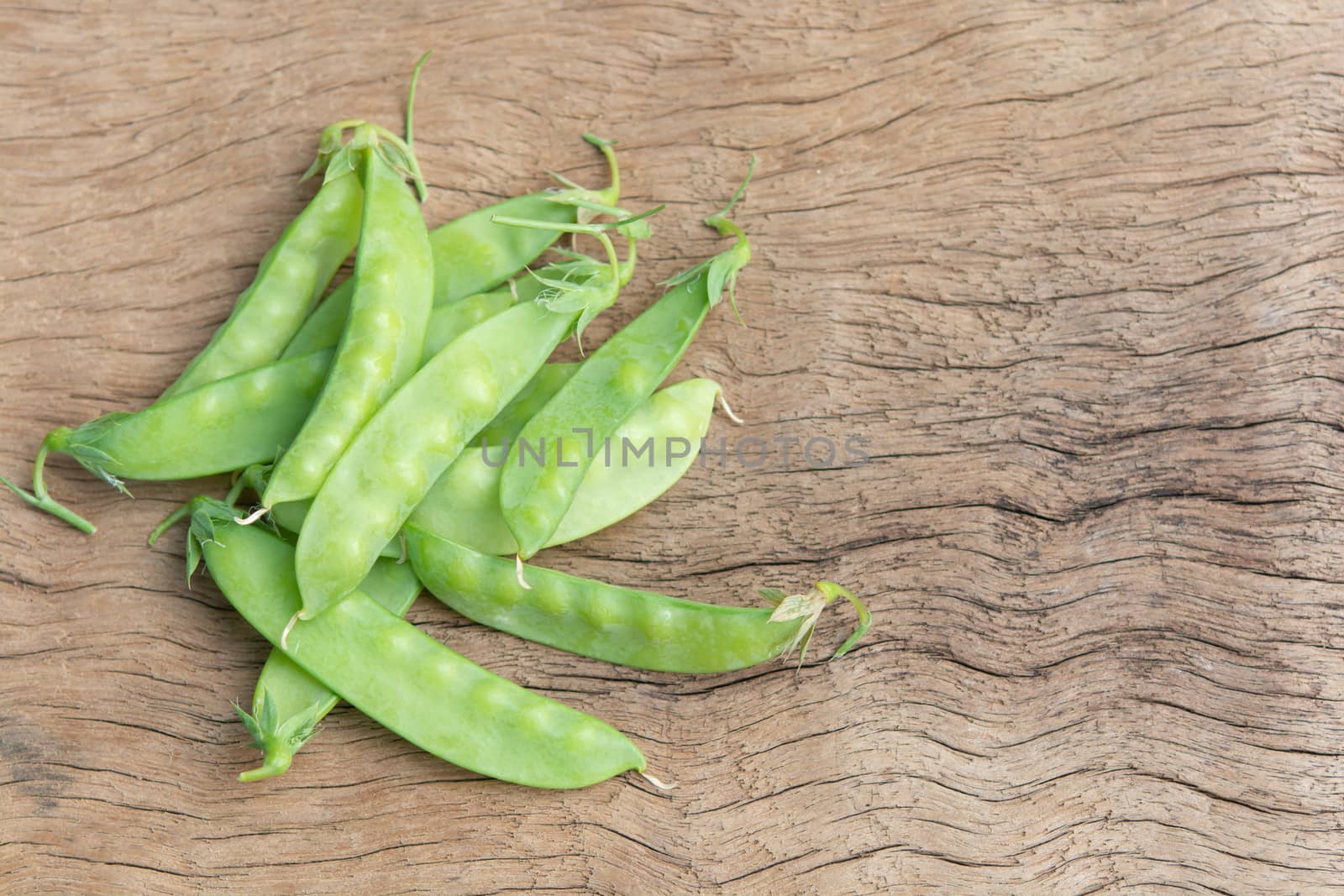 Sugar Pea, Snow peas on plank wooden background