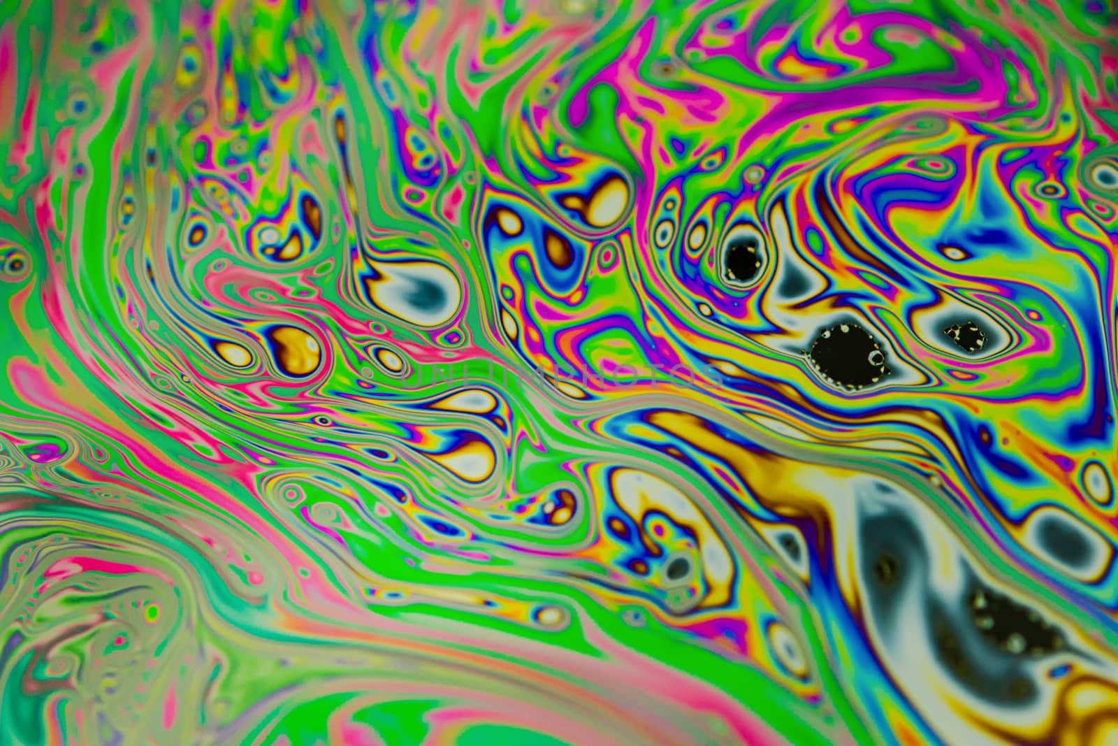 Close up soap bubble background. Psychedelic abstract background