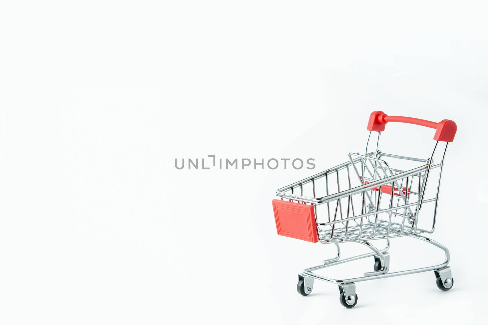 Shopping concept : Red shopping cart on white background with copy space