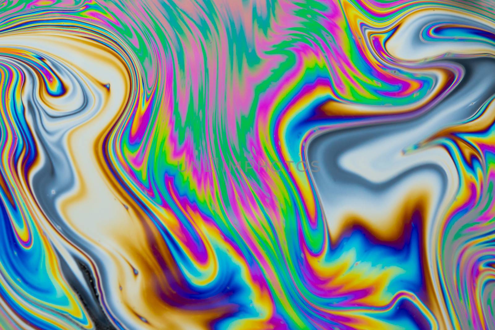 Psychedelic multicolored patterns background. Photo macro shot of soap bubbles