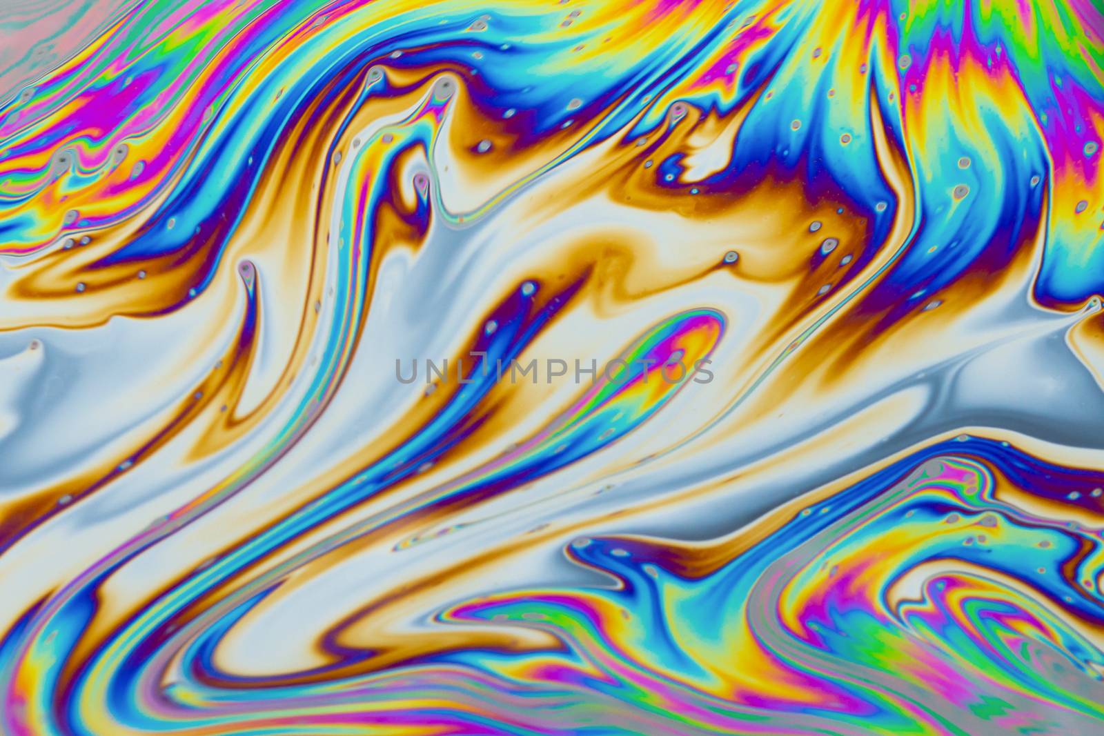 Psychedelic multicolored patterns background. Photo macro shot of soap bubbles