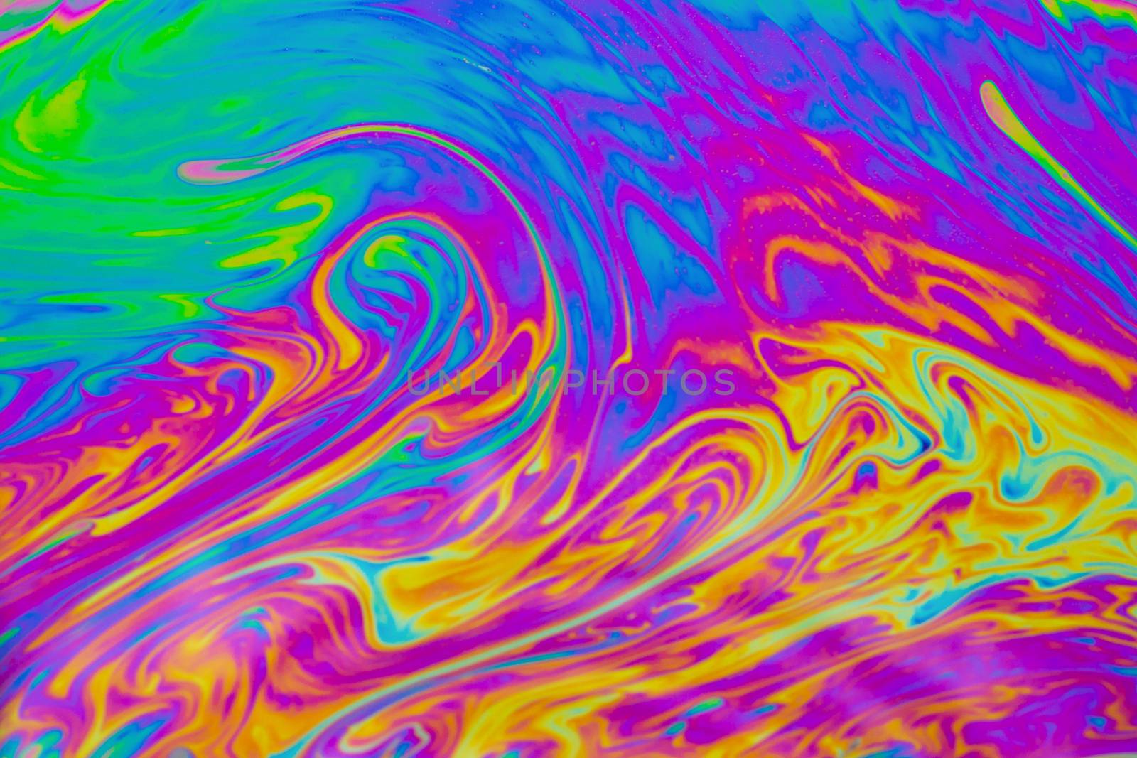 Psychedelic multicolored patterns background. Photo macro shot of soap bubbles