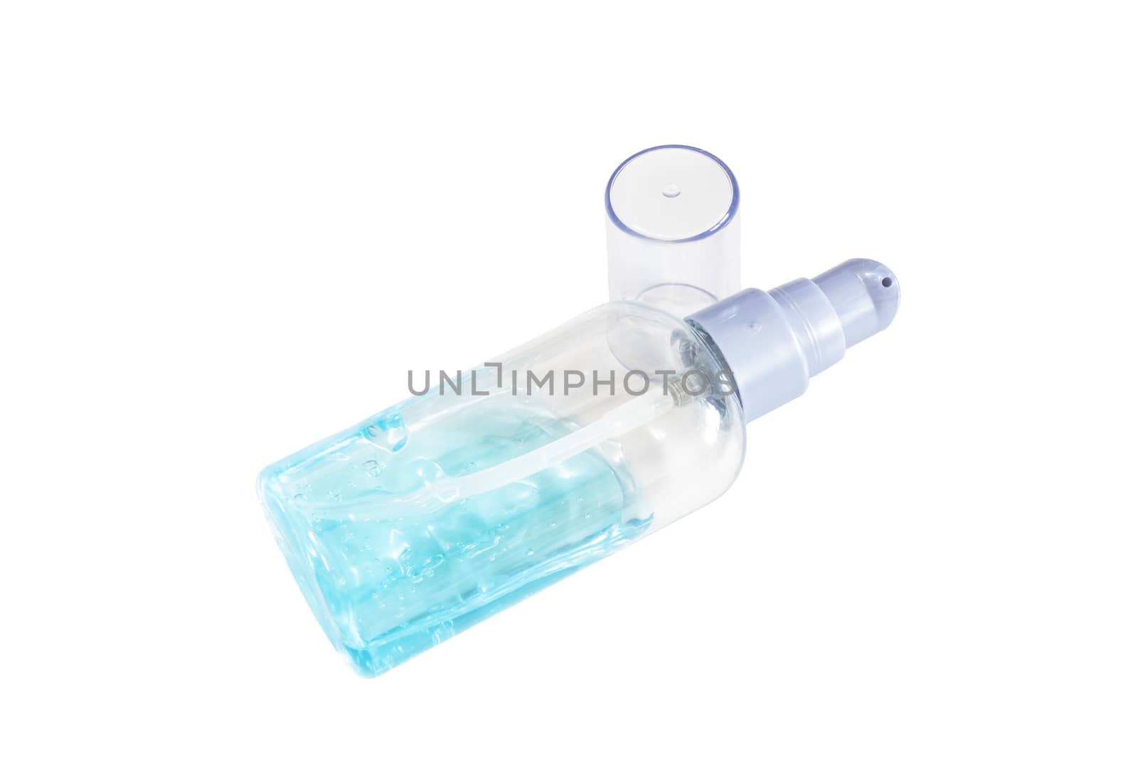 The close up of alcohol gel in small transparent plastic bottle on white background.